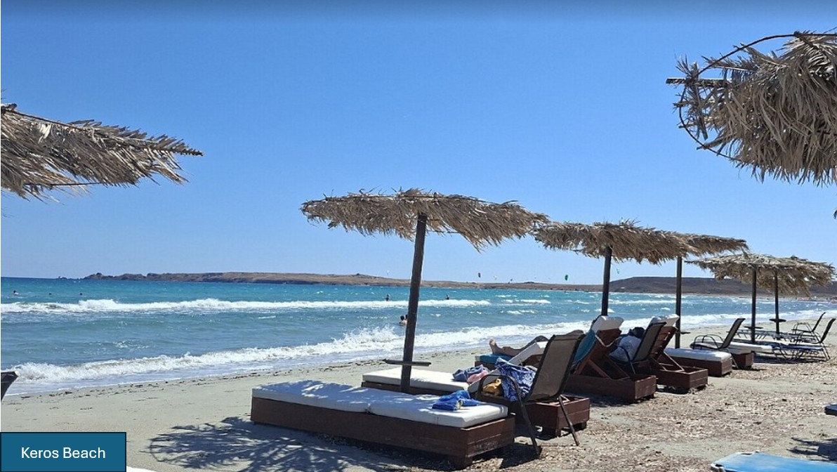Keros Beach with straw umbrellas and turquoise water